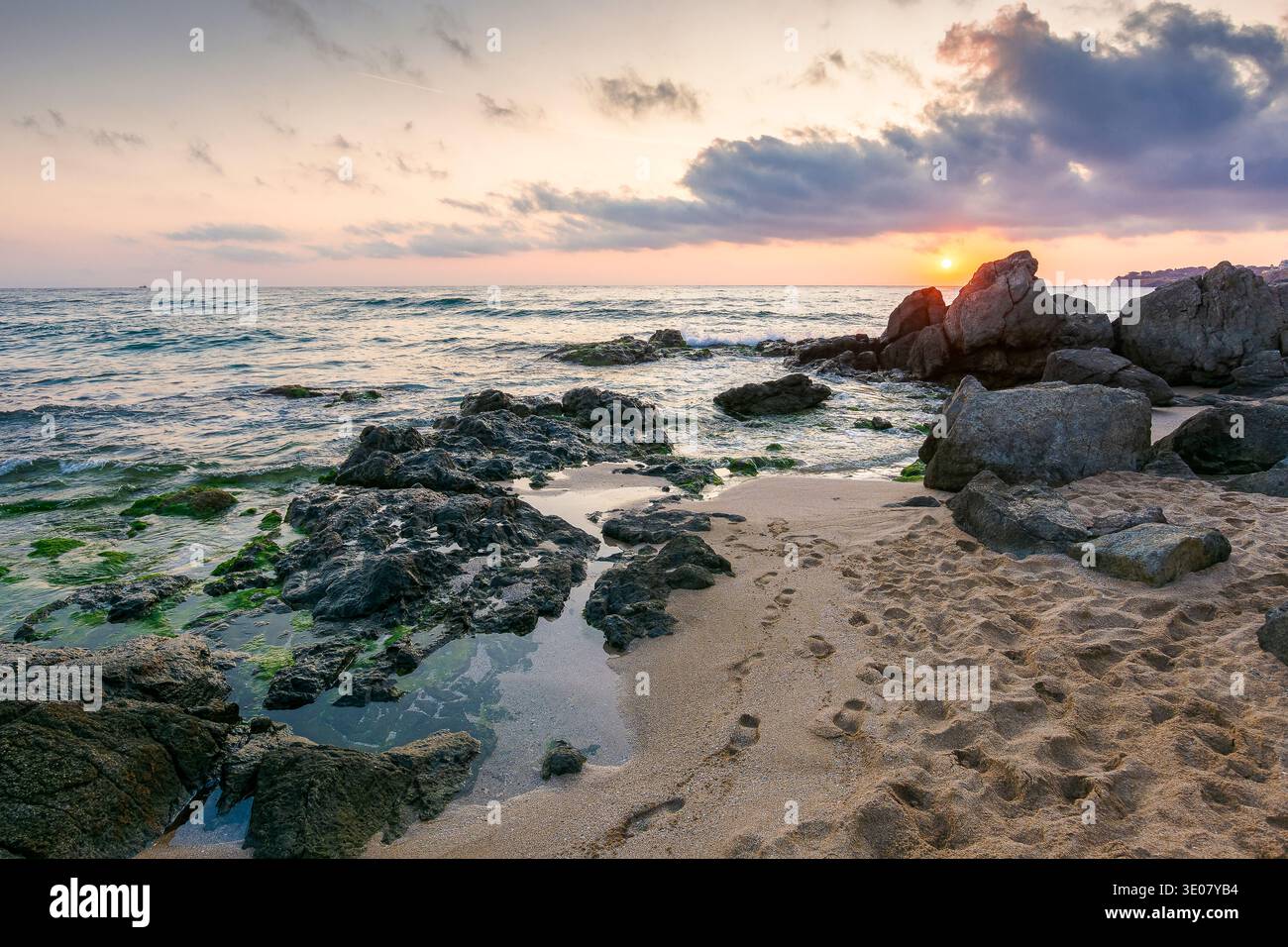 sunrise over sandy beach landscape. coastal seascape scenery of southern bulgaria, sozopol. nature background for summer vacation at the shore of blac Stock Photo
