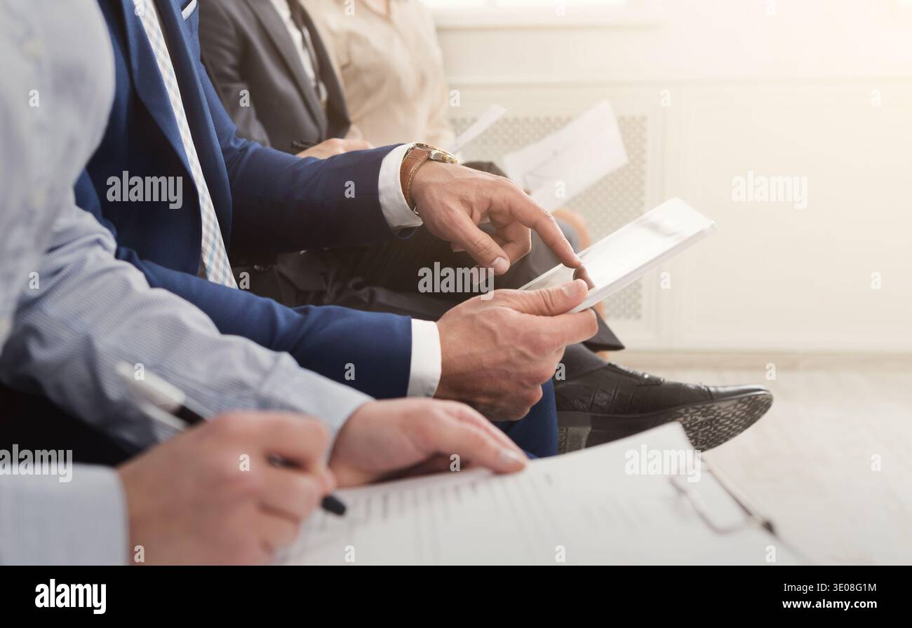 Multiracial people waiting in queue preparing for job interview Stock Photo