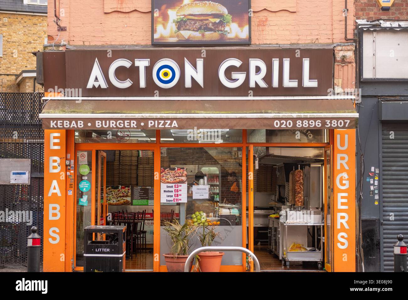 LONDON - JANUARY 20, 2026: Acton Grill – kebab, burger and pizza restaurant on Acton high street Stock Photo