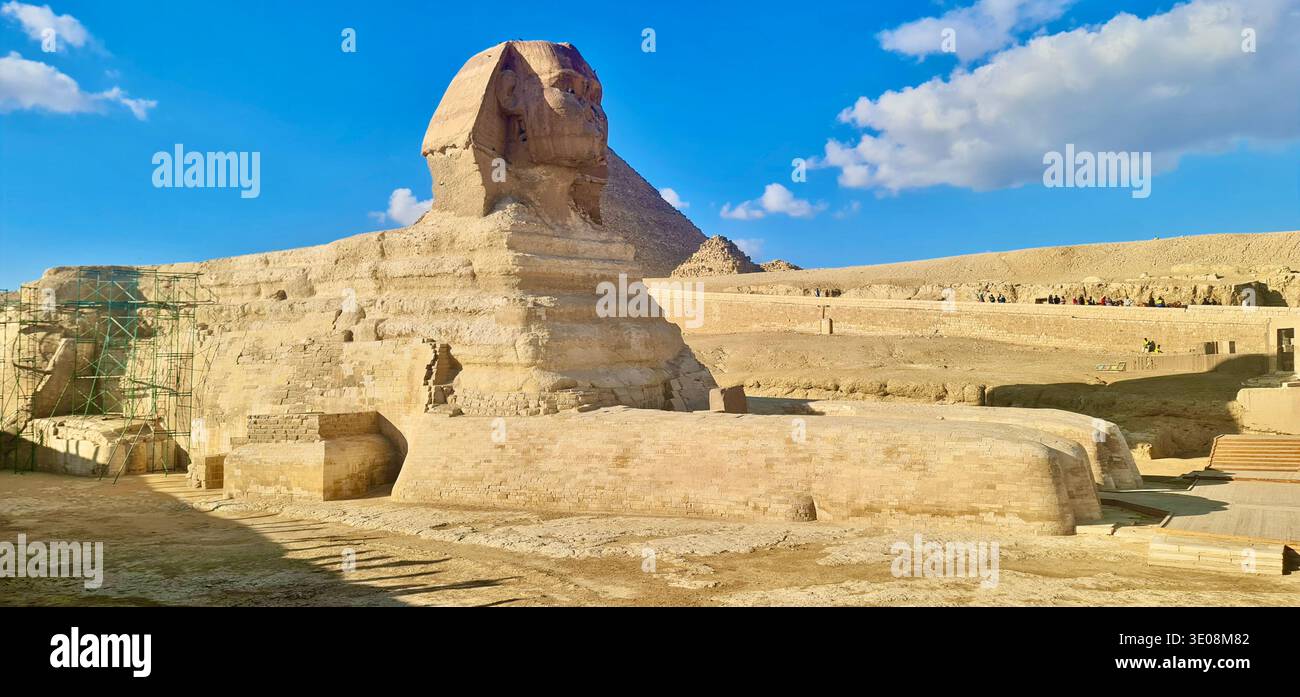 Great Sphinx statue at Giza Necropolis under blue sky with ancient ...