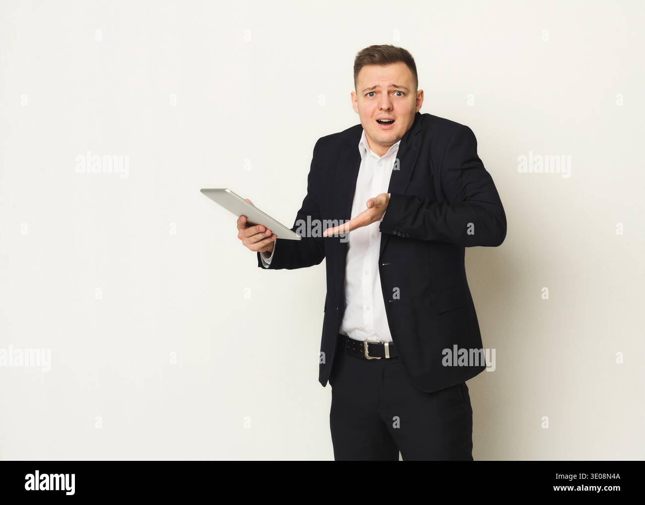 Disappointed caucasian businessman using laptop Stock Photo