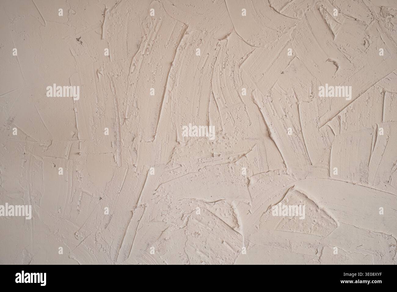 Rugged effect plaster beige color cement wall textured background Stock Photo