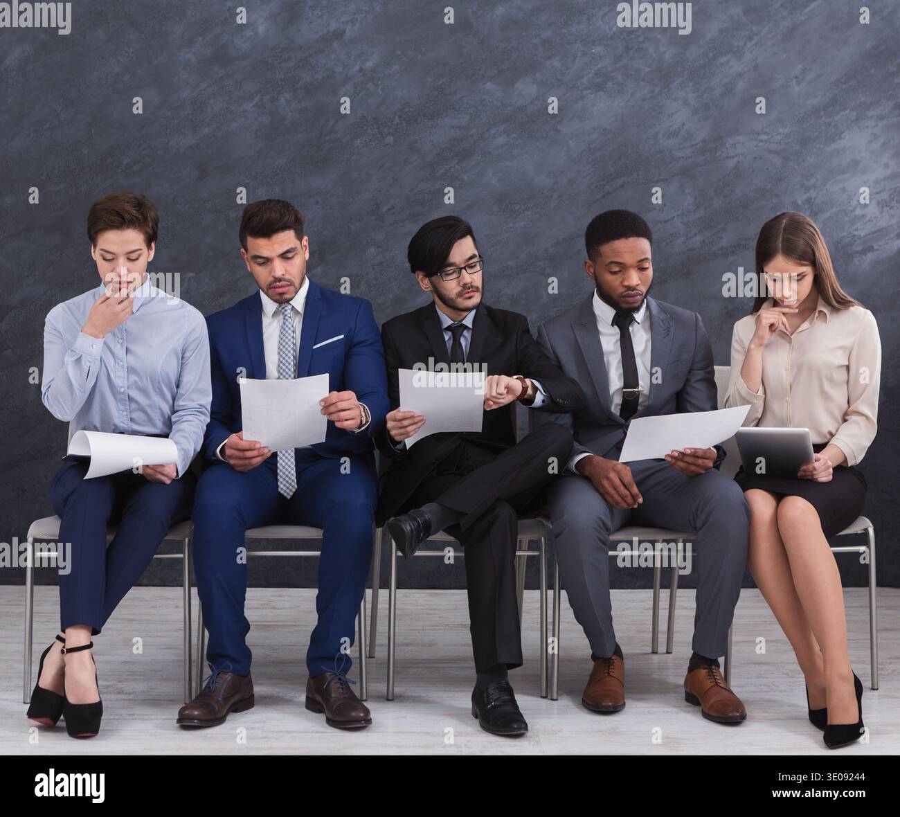 Multiethnic job candidates preparing for job interview Stock Photo