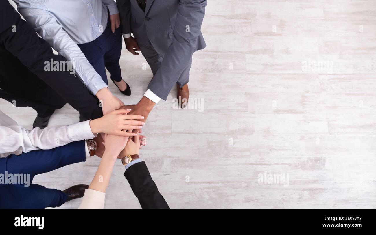 Business people put hands together on white background Stock Photo