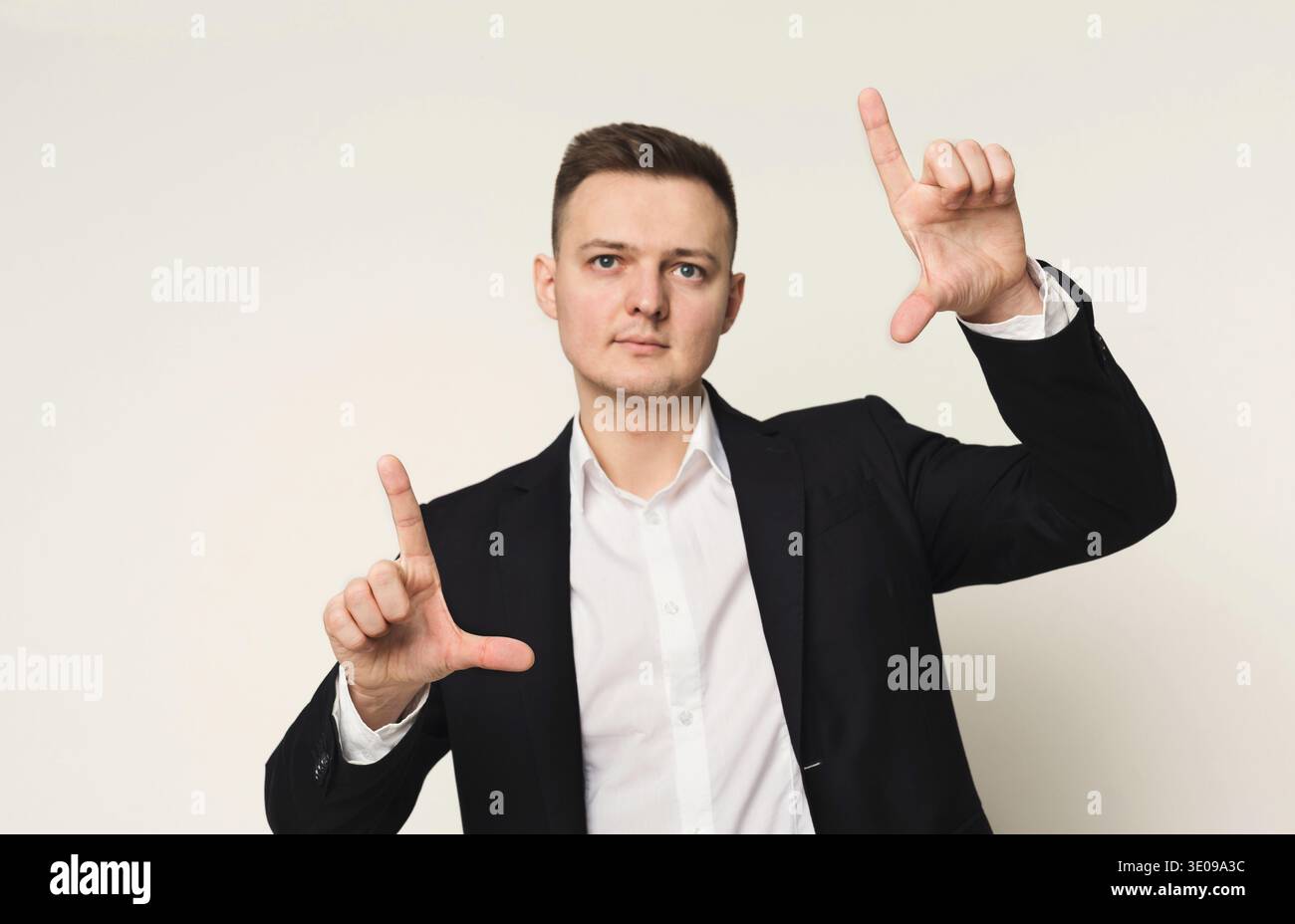 Young businessman using virtual screen for work Stock Photo