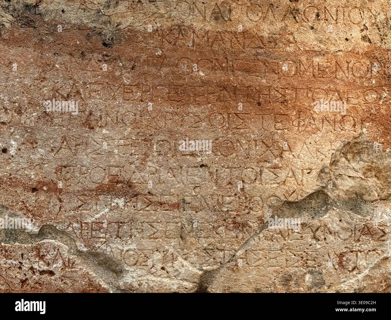 Ancient Greek inscription on weathered stone surface with lettering ...