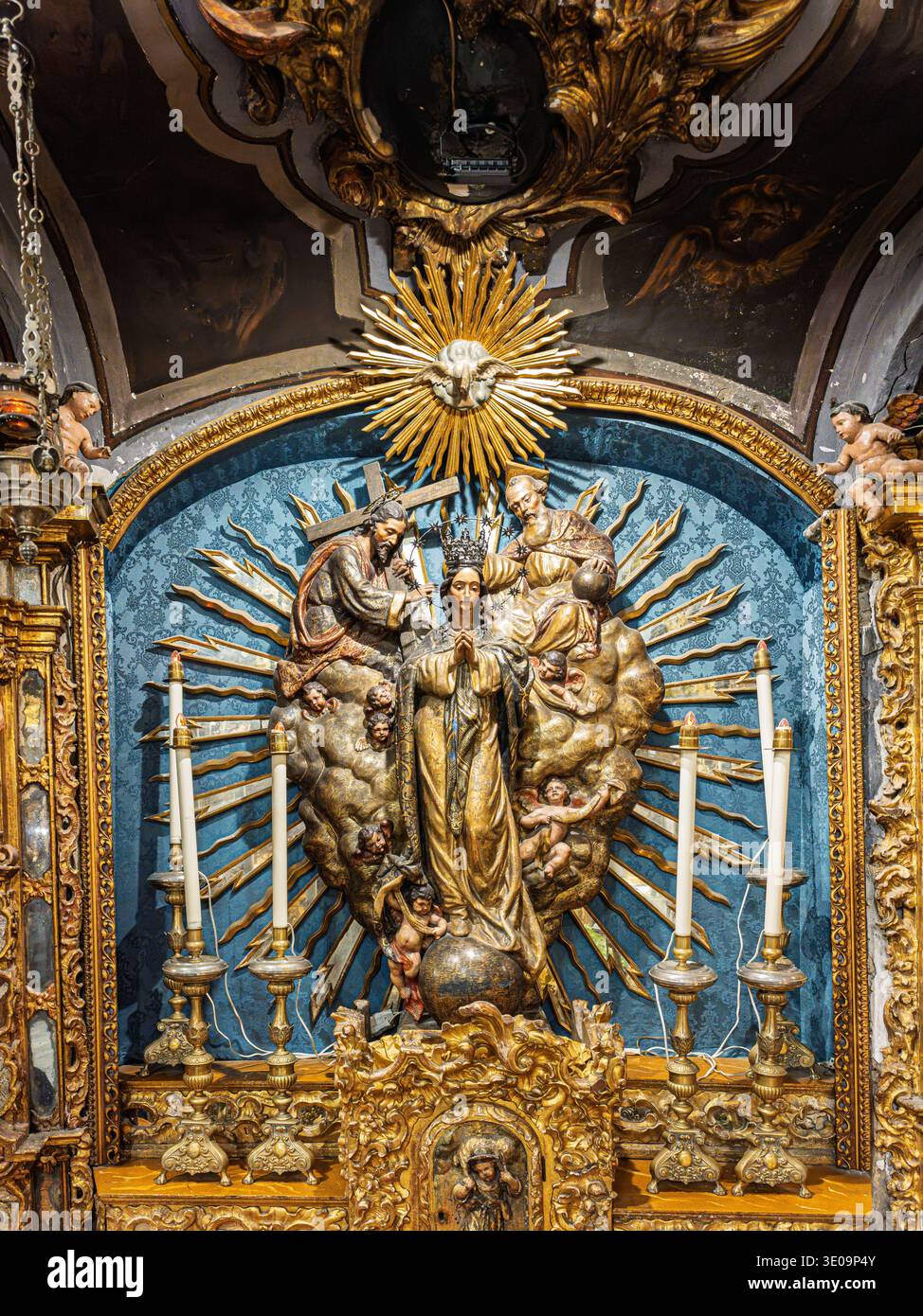 Ornate Baroque altarpiece featuring the Virgin of the Three Hail Marys ...