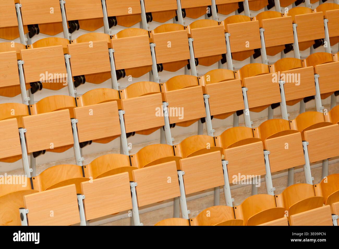 Empty classroom with wood chairs. Stock Photo