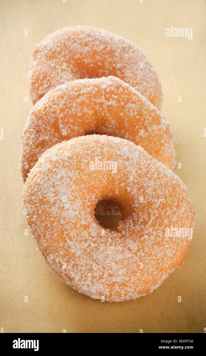 Donuts on beige paper background Stock Photo
