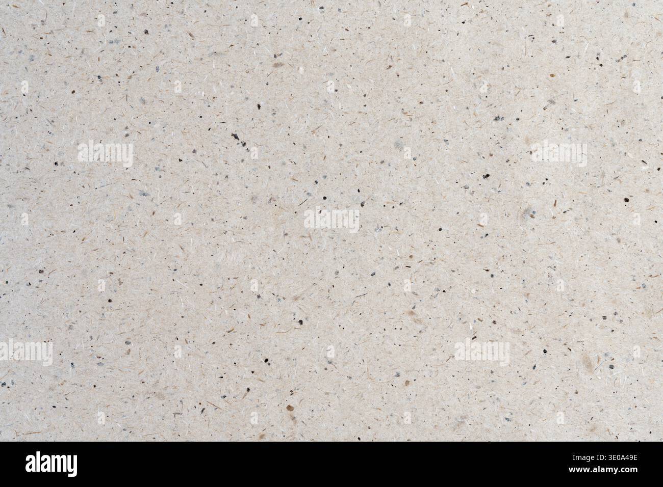 Minimalist light beige kraft paper texture background with fine dark dots pattern and copy space Stock Photo