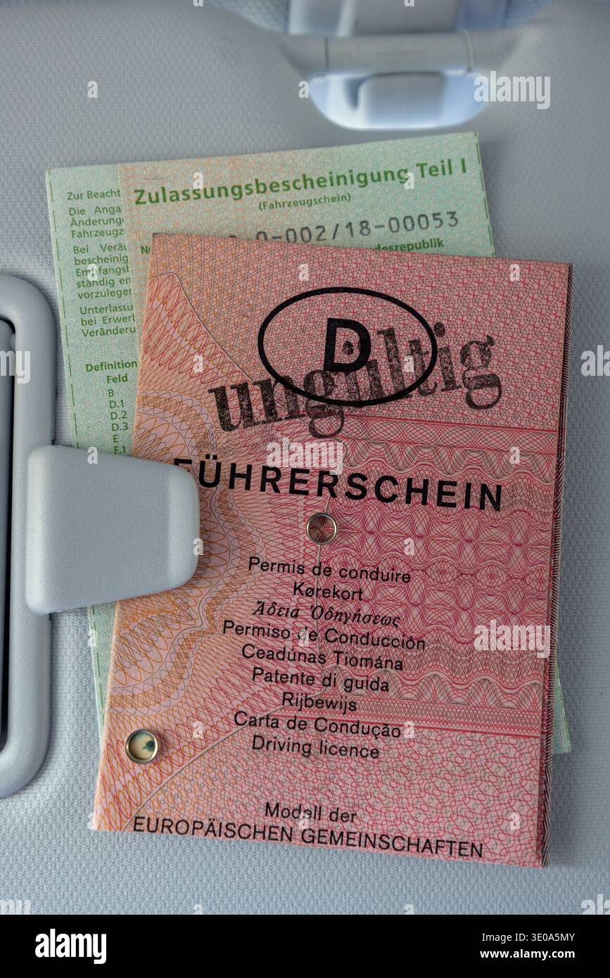 Car sun visor, registration certificate part I and old pink paper ...