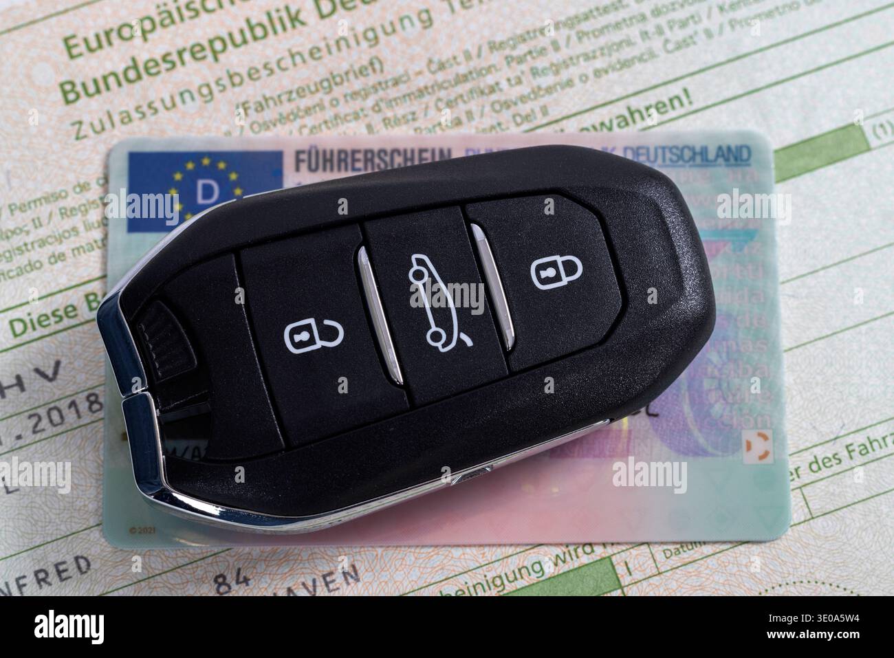 Car keys and EU card driver's license are on registration certificate ...