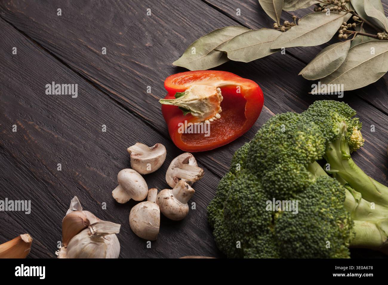 Fresh tomatoes and chilli closeup on grey rustic wood Stock Photo