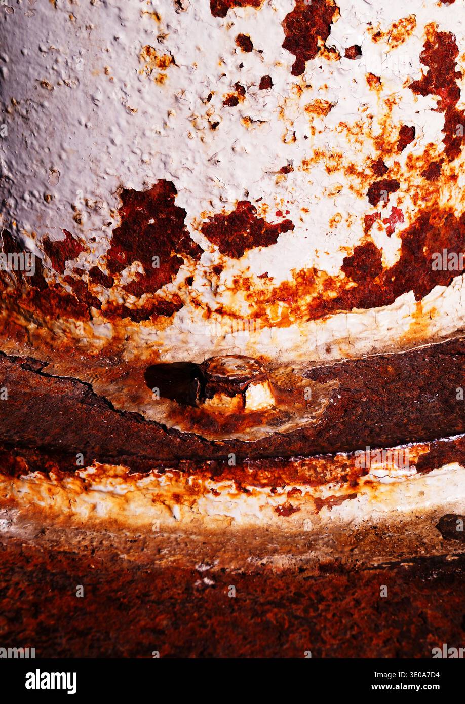 A rusty screw, chipped paint, metal. Stock Photo