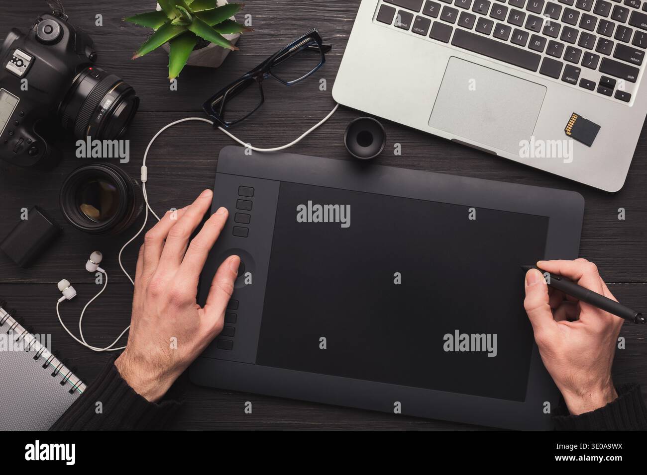 Designer hand with graphic tablet and keyboard Stock Photo