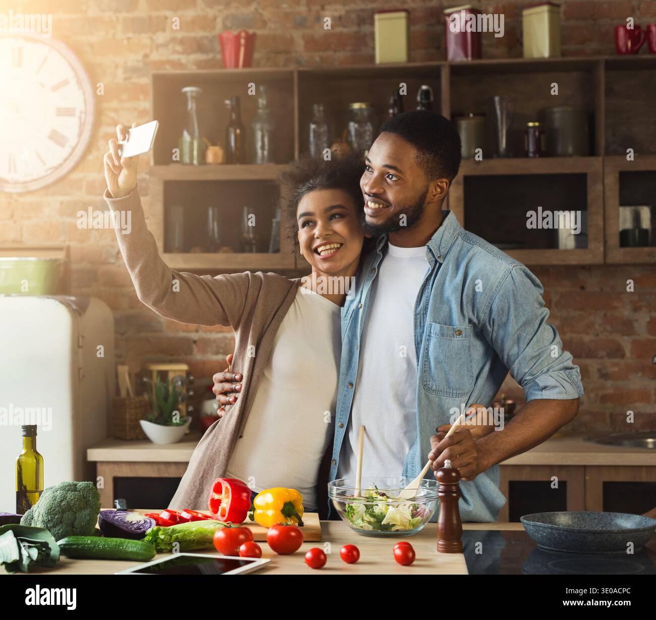 Happy black couple taking selfie at kitchen Stock Photo