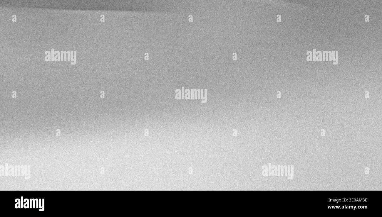 A close-up, abstract view of a silver metallic surface featuring a fine, uniform grain or noise texture. The lighting creates a subtle horizontal grad Stock Photo