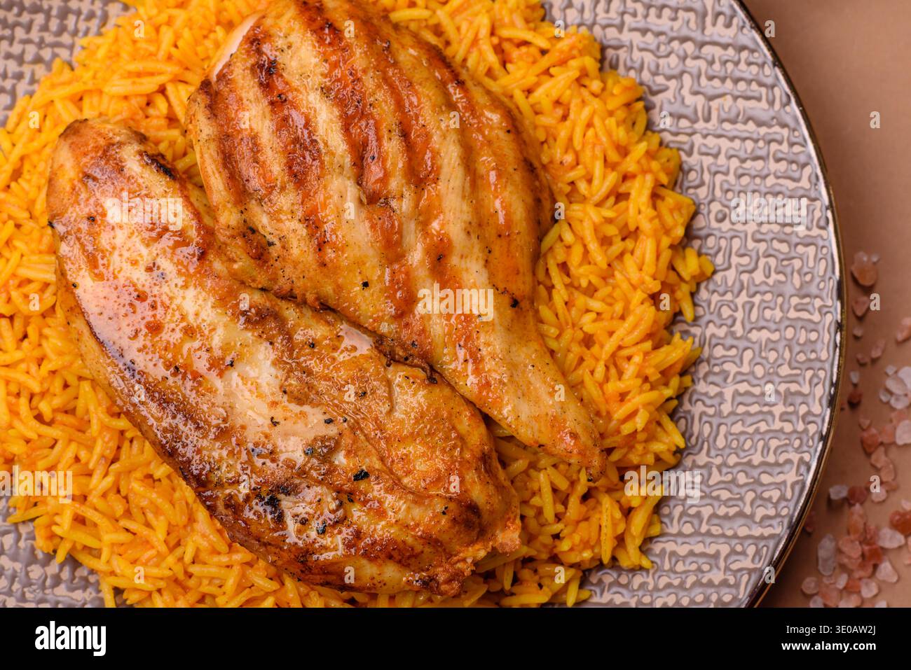 Kabsa or haneeth, an Arabic dish with rice and chicken, salt, and ...