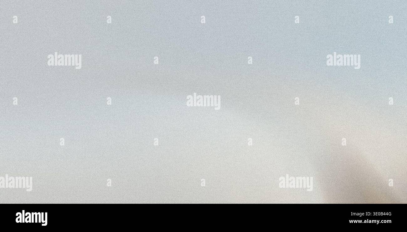 A subtle gray speckled texture creates a neutral and versatile background for various design applications Stock Photo