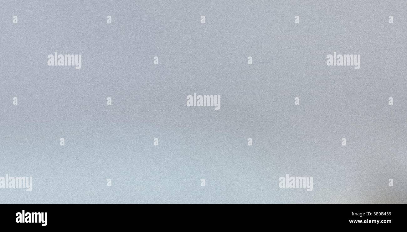A subtle gray speckled texture creates a neutral and versatile background for various design applications Stock Photo