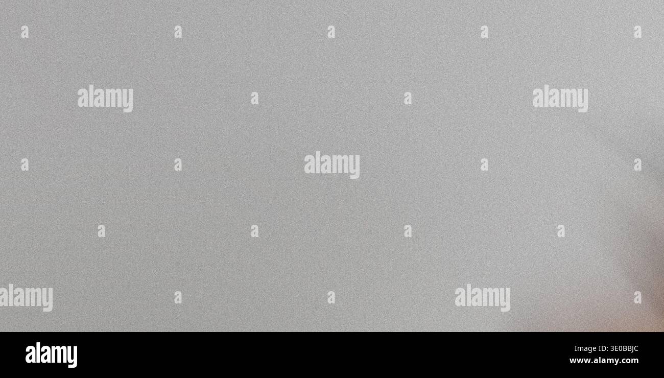 A subtle gray grainy texture creates a versatile abstract background with a rough, vintage feel Stock Photo