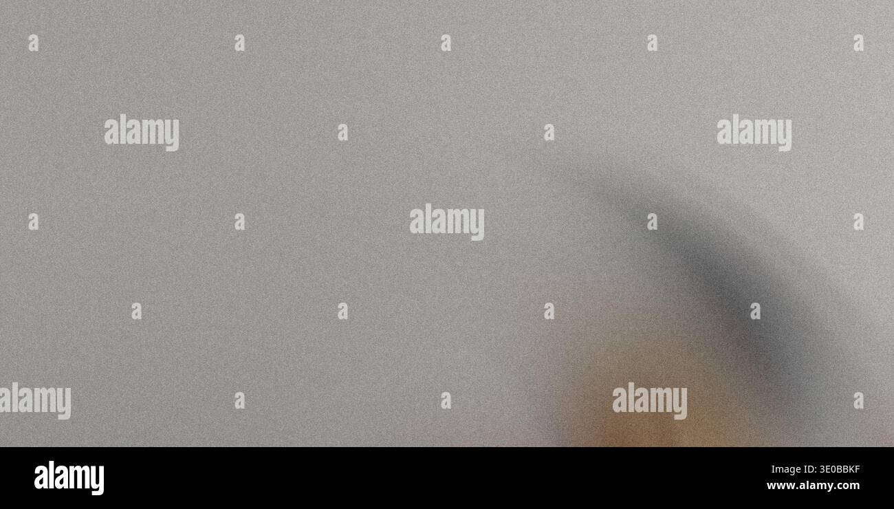 A subtle gray grainy texture creates a versatile abstract background with a rough, vintage feel Stock Photo