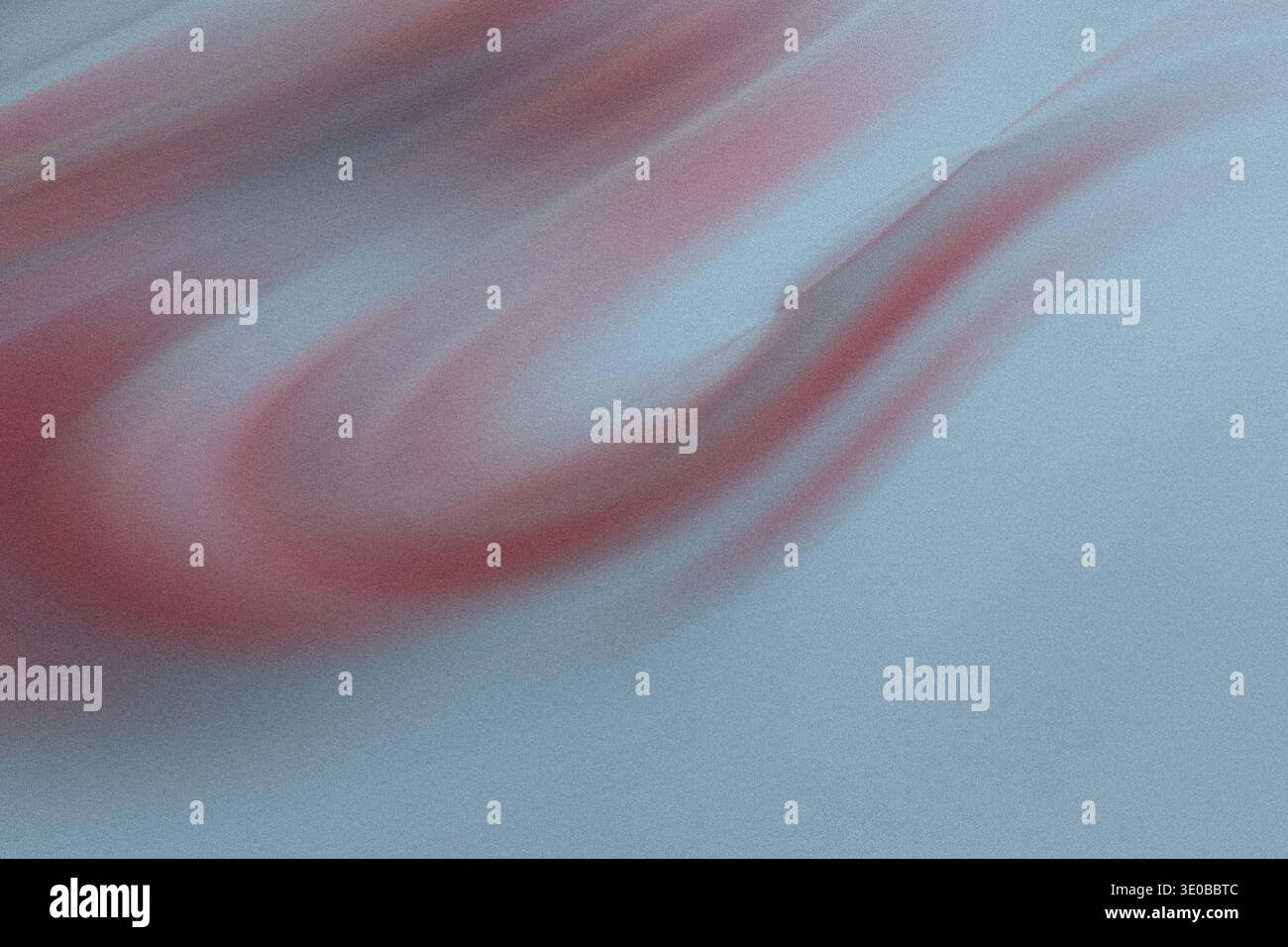 A textured blue background features a soft, flowing red wave, creating a gentle and abstract design with movement Stock Photo