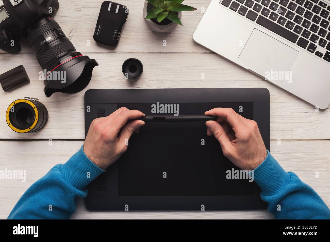 Designer hand working with graphic tablet Stock Photo