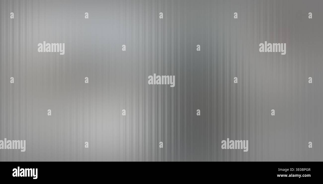 A brushed metal surface with vertical lines creates a textured background with a subtle gradient Stock Photo