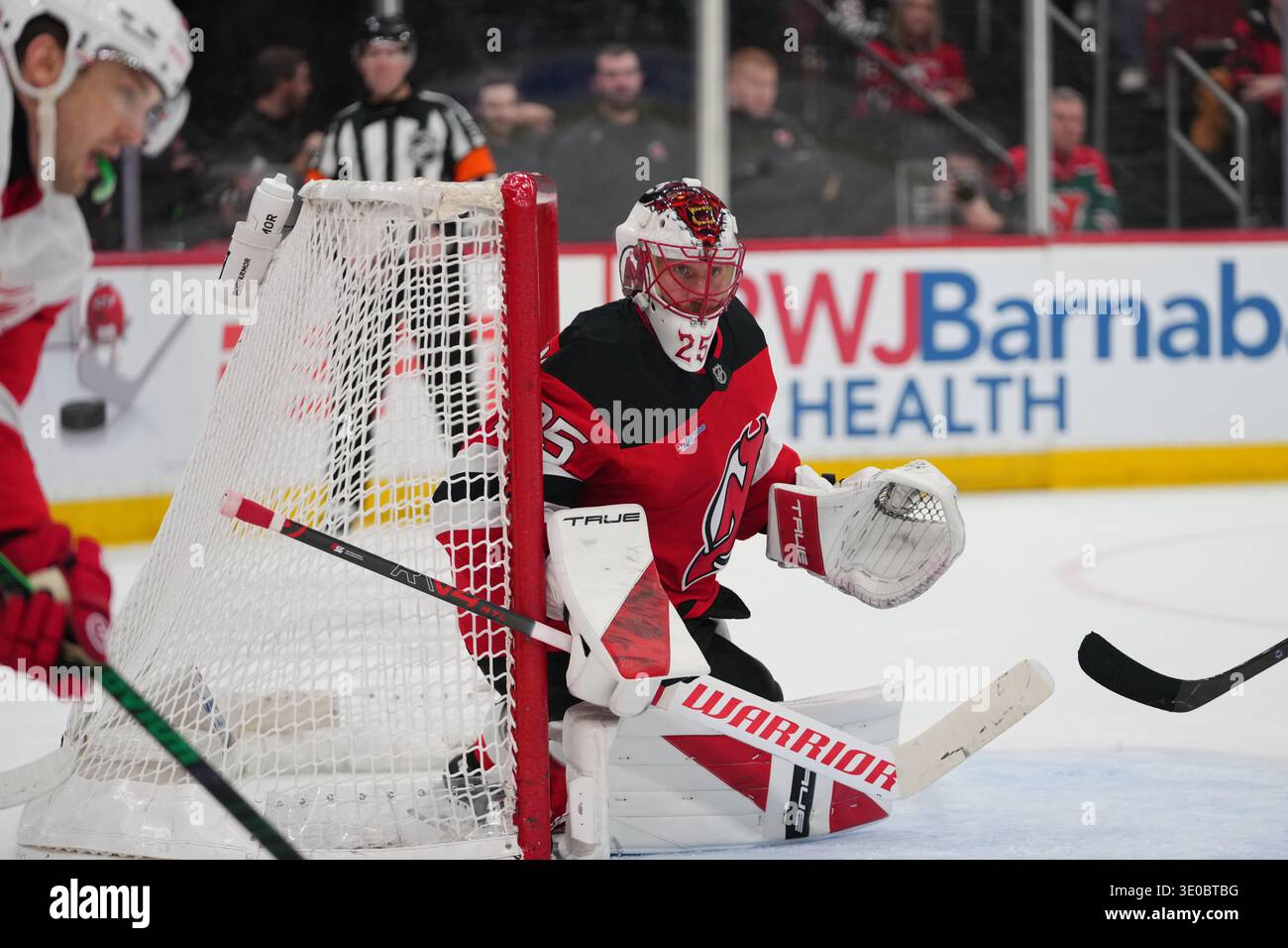New Jersey Devils goaltender Jacob Markstrom (25) protects the net ...