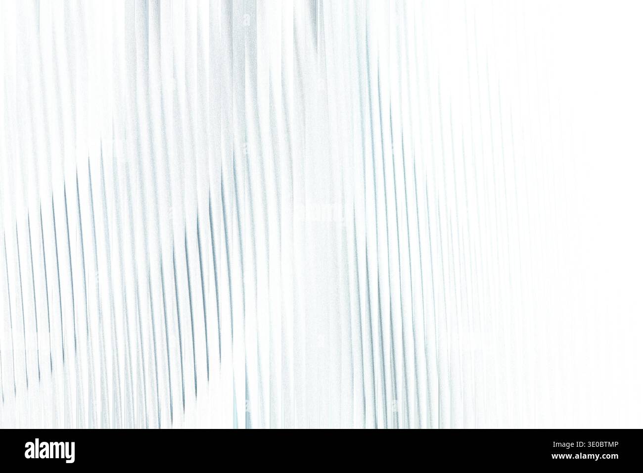 Abstract textured background with delicate vertical blue lines on a bright white canvas, creating a sense of gentle movement and light Stock Photo