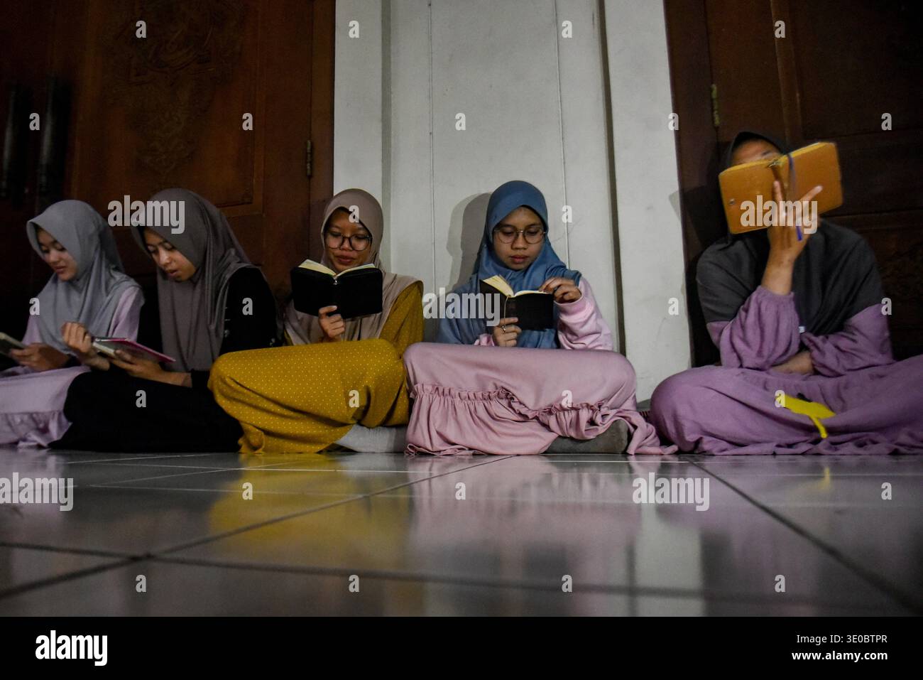 Bandung, West Java, Indonesia. 11th Mar, 2026. Muslim women reads the ...