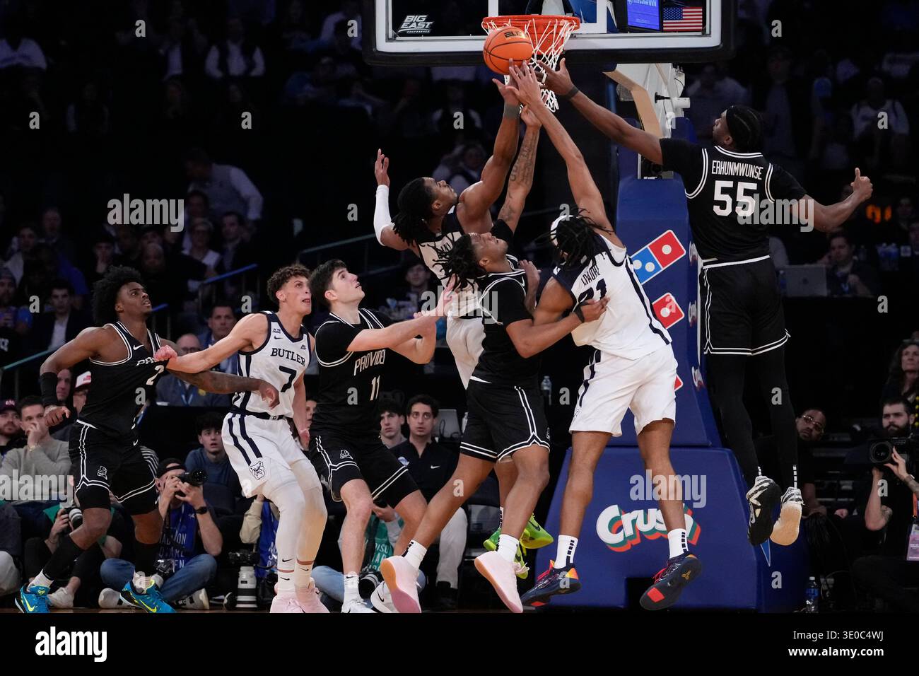 Players of Providence and Butler reach for the ball during the second ...