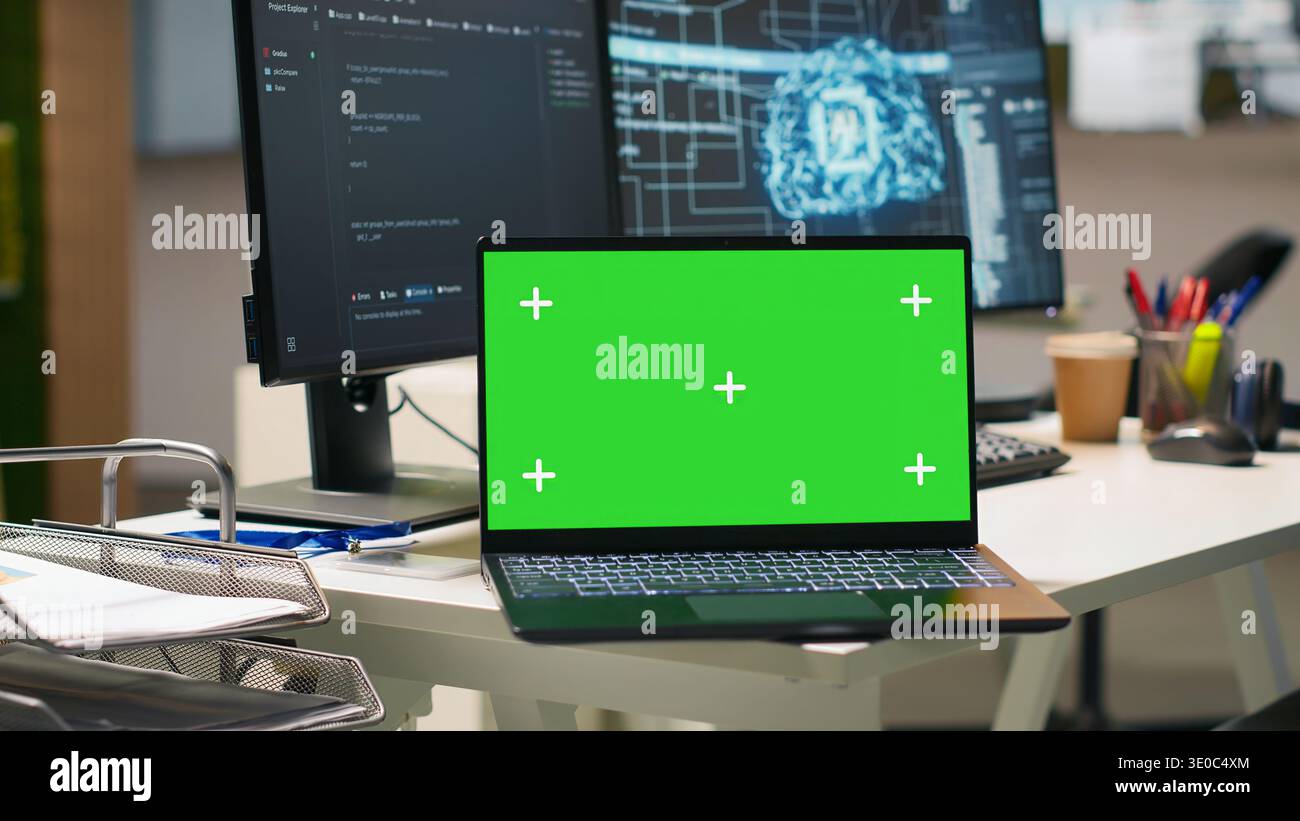Isolated screen laptop in empty AI startup office displaying programming languages used for building applications. Chroma key notebook showing deep learning code in software development agency Stock Photo