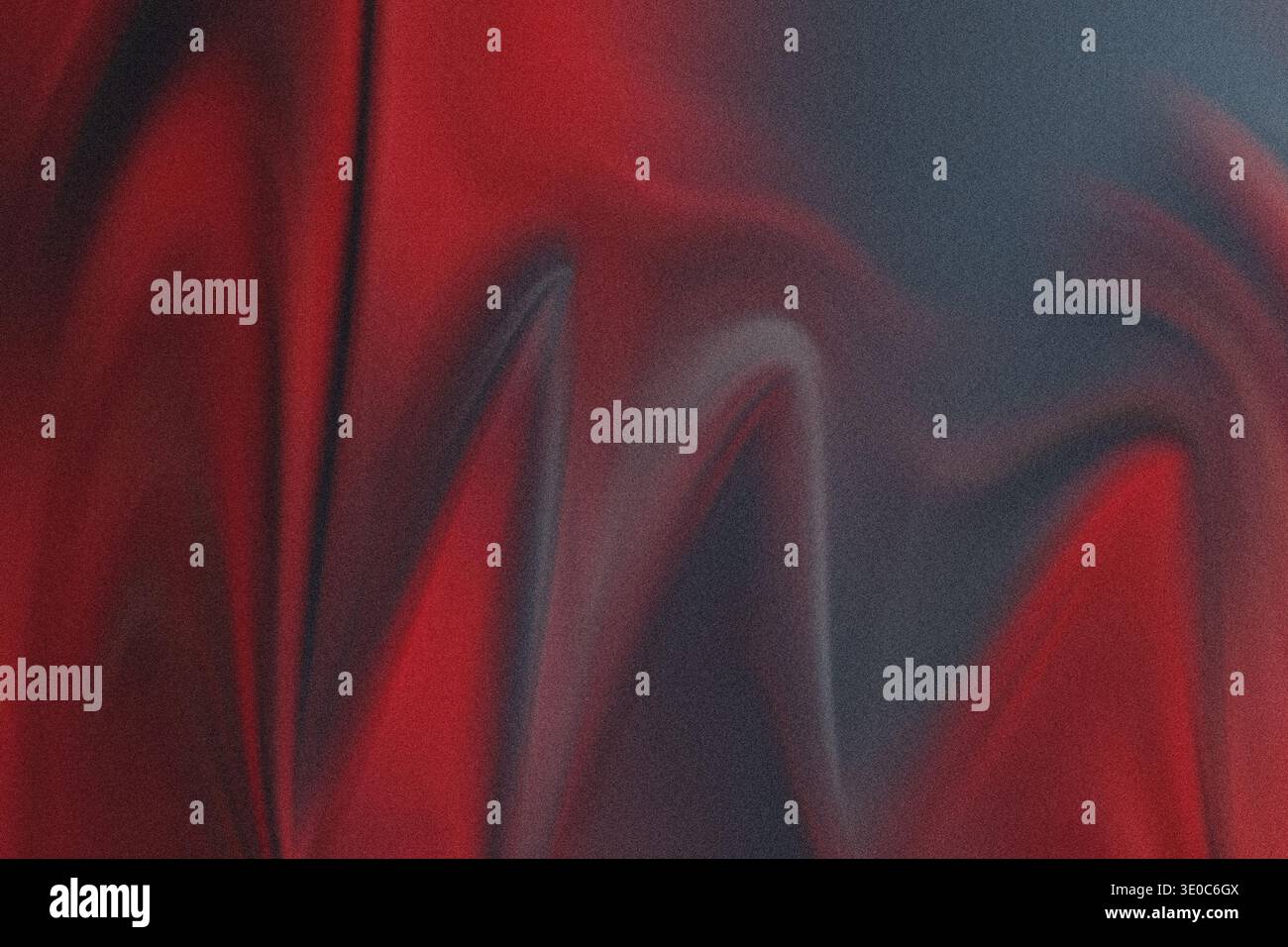 An abstract, heavily textured image dominated by deep reds and contrasting dark gray/black areas, resembling spray paint or a distressed surface. The Stock Photo