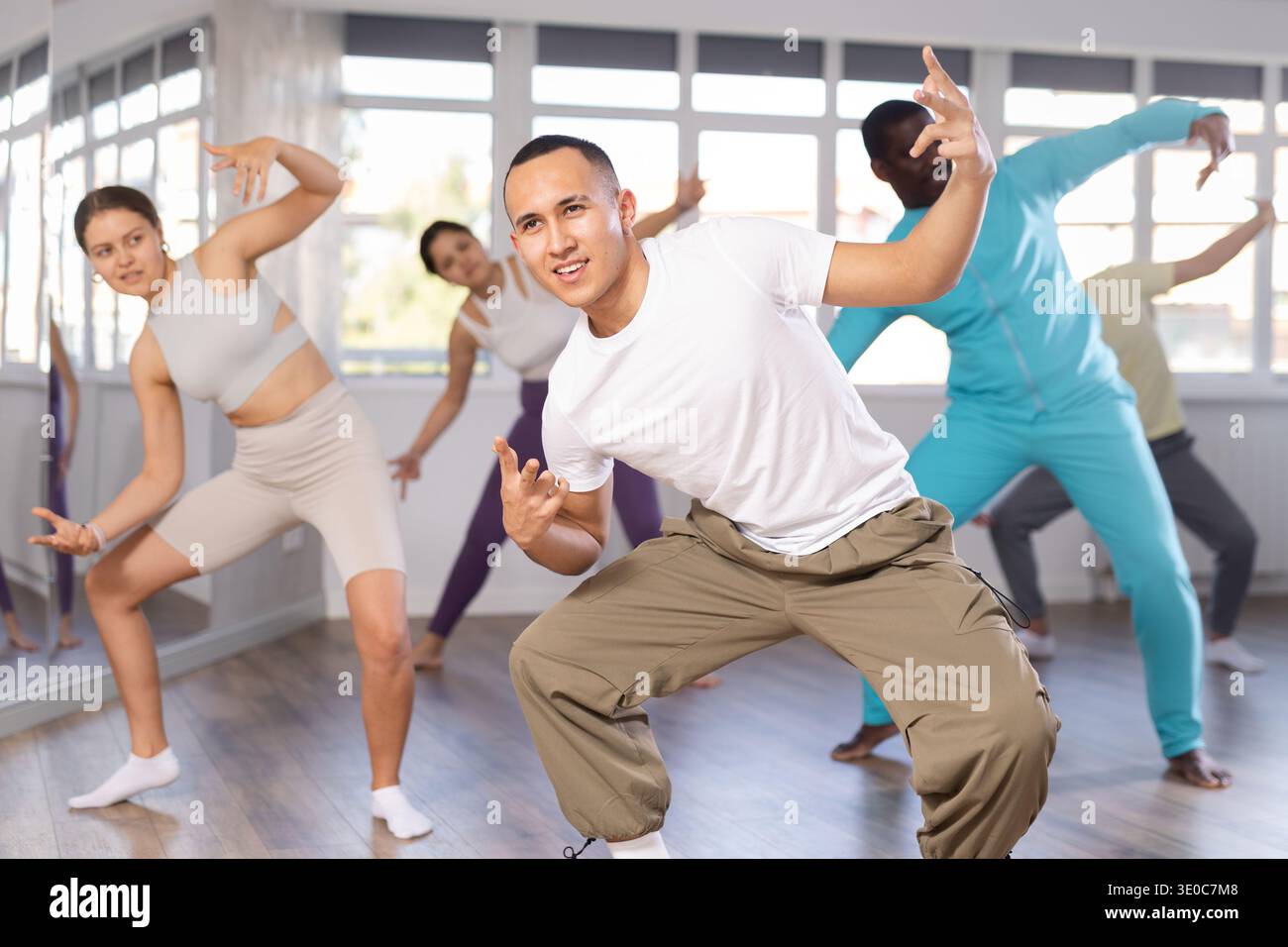 Young Asian man practicing modern street dancing in studio Stock Photo