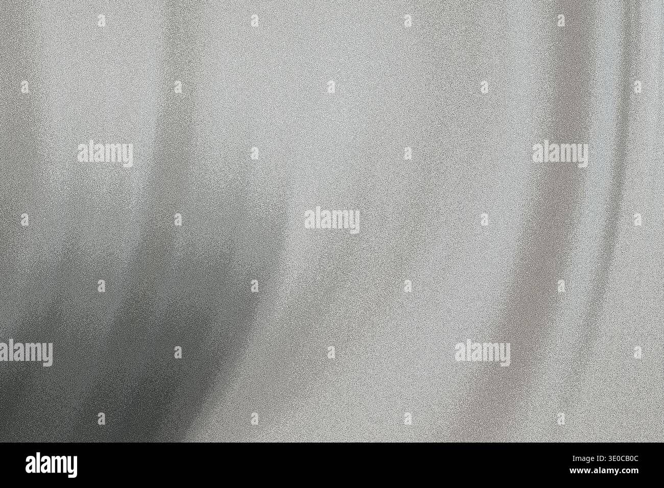 The image shows a blurred, out-of-focus close-up of a light-colored fabric exhibiting a gradient from light gray to darker gray. The texture is soft a Stock Photo