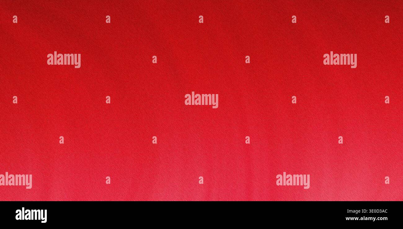 A slightly blurred image featuring a solid red background. The texture is smooth with subtle variations in shade. Stock Photo