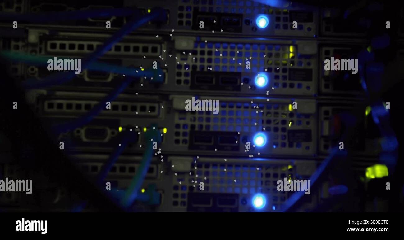 Displaying rack-mounted server blades inside server rack, showing teal Ethernet cables and LEDs Stock Photo