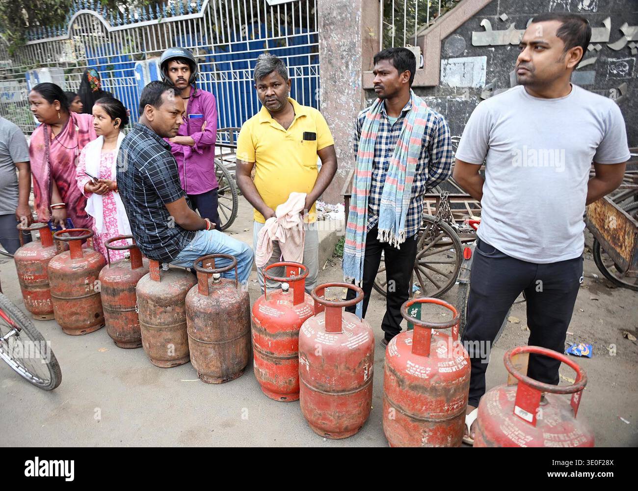 Patna, India. 12th Mar, 2026. PATNA, INDIA - MARCH 11: People wait in queue to book LPG cylinders after shortage of LPG supply, outside of Premchand Rangshala, Rajendra Nagar, on March 11,