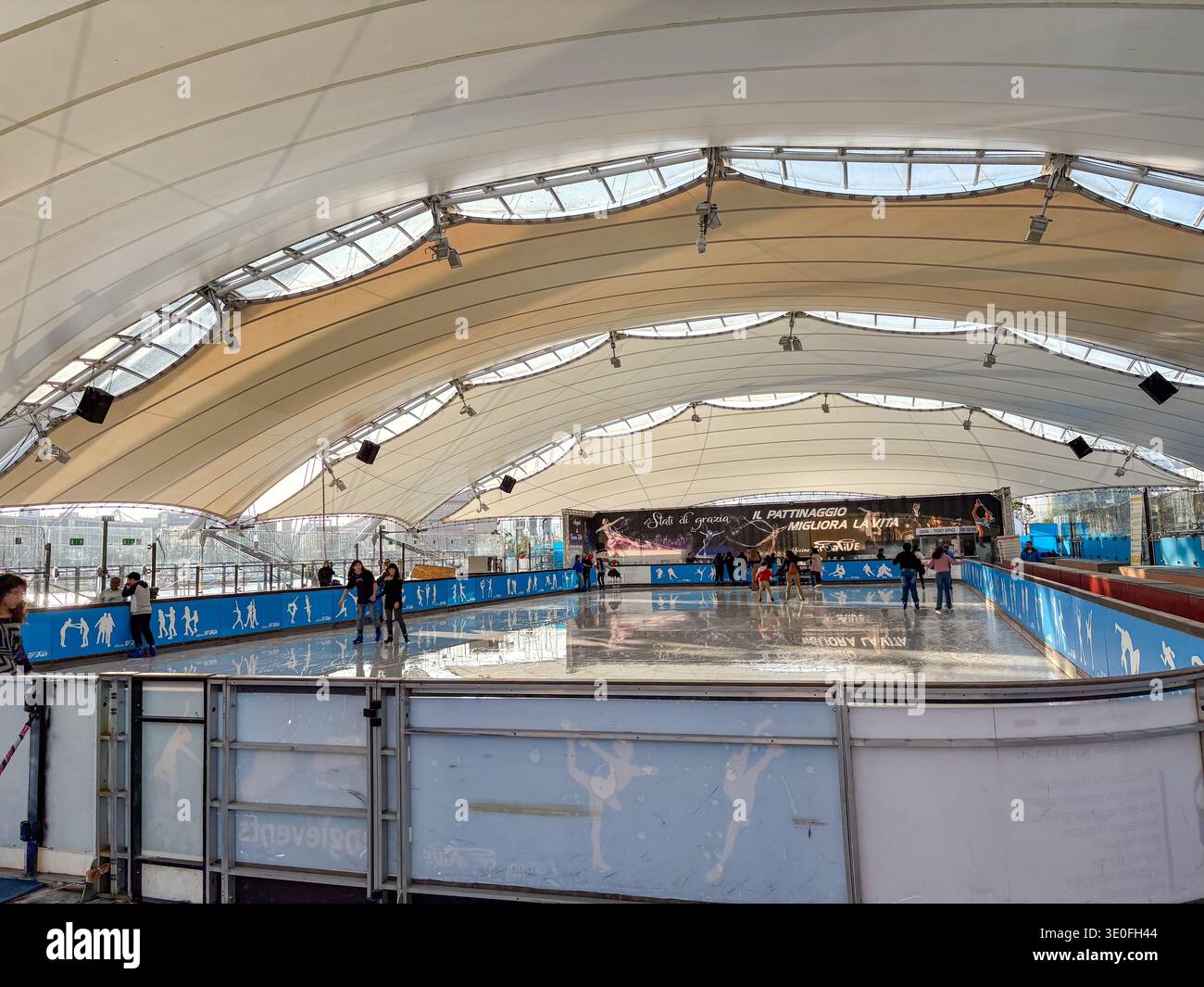 Porto Antico di Genova, Genoa, Italy. Temporary ice rink under a ...
