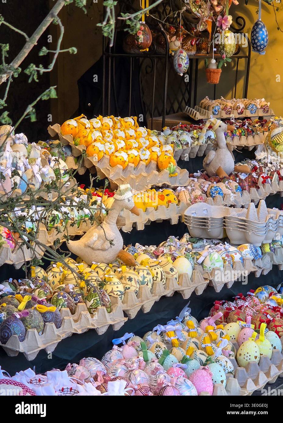 Colorful decorated easter eggs on display at a market stall. Stock Photo