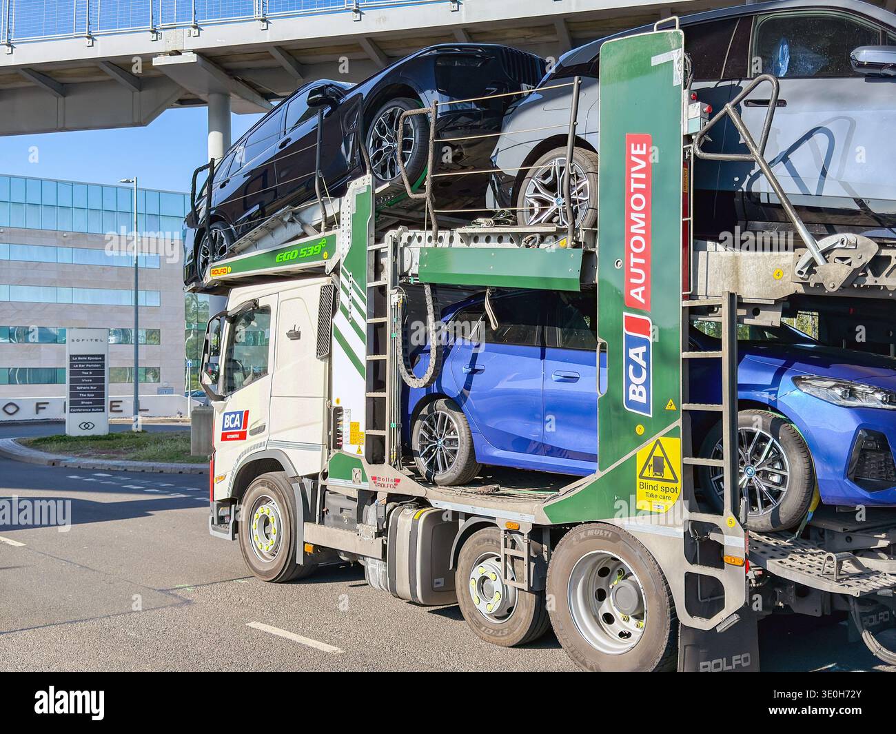 London, England, UK - 20 May 2025: Car transporter driving on a road in London. The vehicle is operated by BCA Automotive, British Car Auctions - Smartphone Captured Stock Image