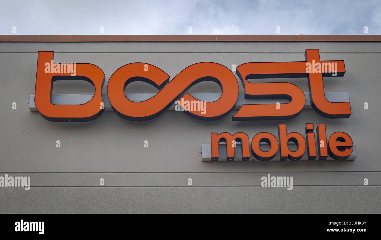 Sign at the entrance to a Boost Mobile store in Venice, Florida. (Photo ...