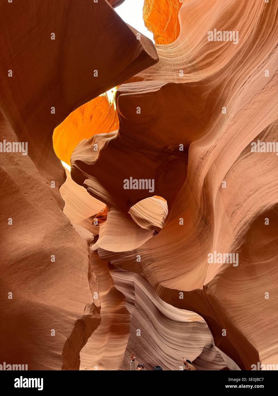 View from inside slot canyon with sculpted sandstone formations and sky visible through narrow opening in Arizona, USA. - Smartphone Captured Stock Image