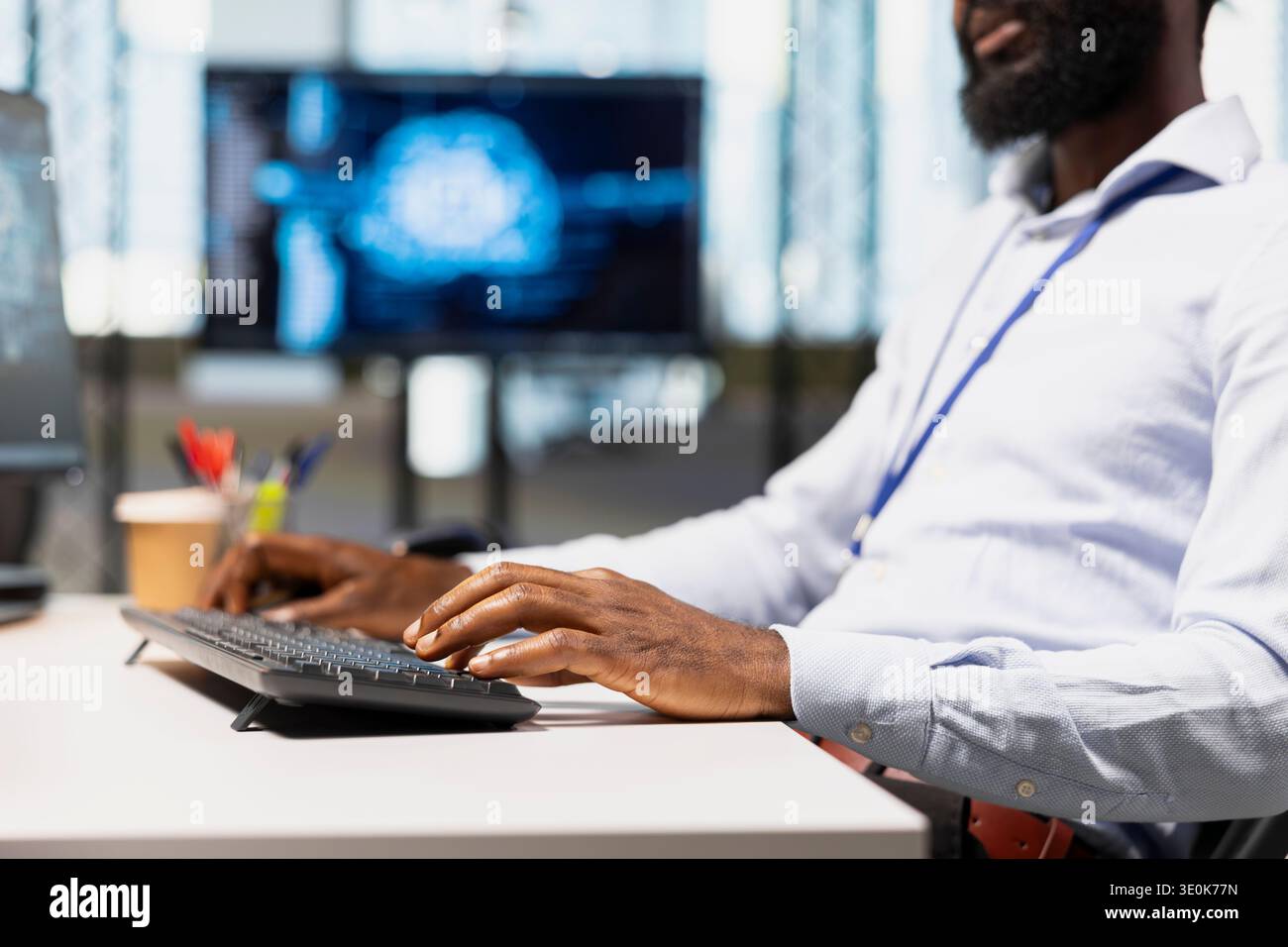 Close up of programmer typing on keyboard, utilizing AI to optimize performance and forecast issues. Employee writing code in office, training machine learning models using PC Stock Photo