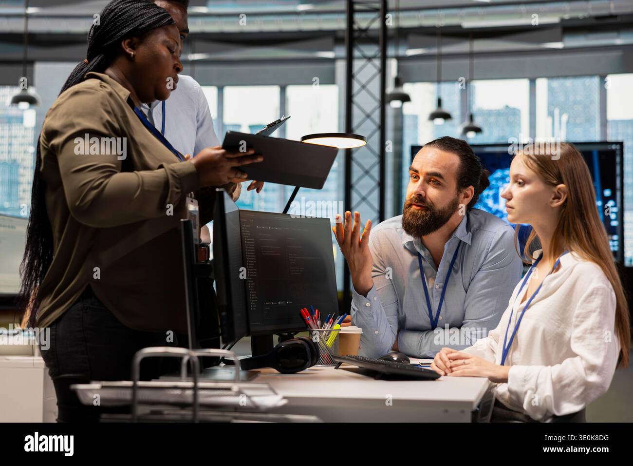 Team of software developers in office using AI automation scripts to reduce repetitive coding tasks. Coworkers doing brainstorming, using artificial intelligence technology in startup workspace Stock Photo