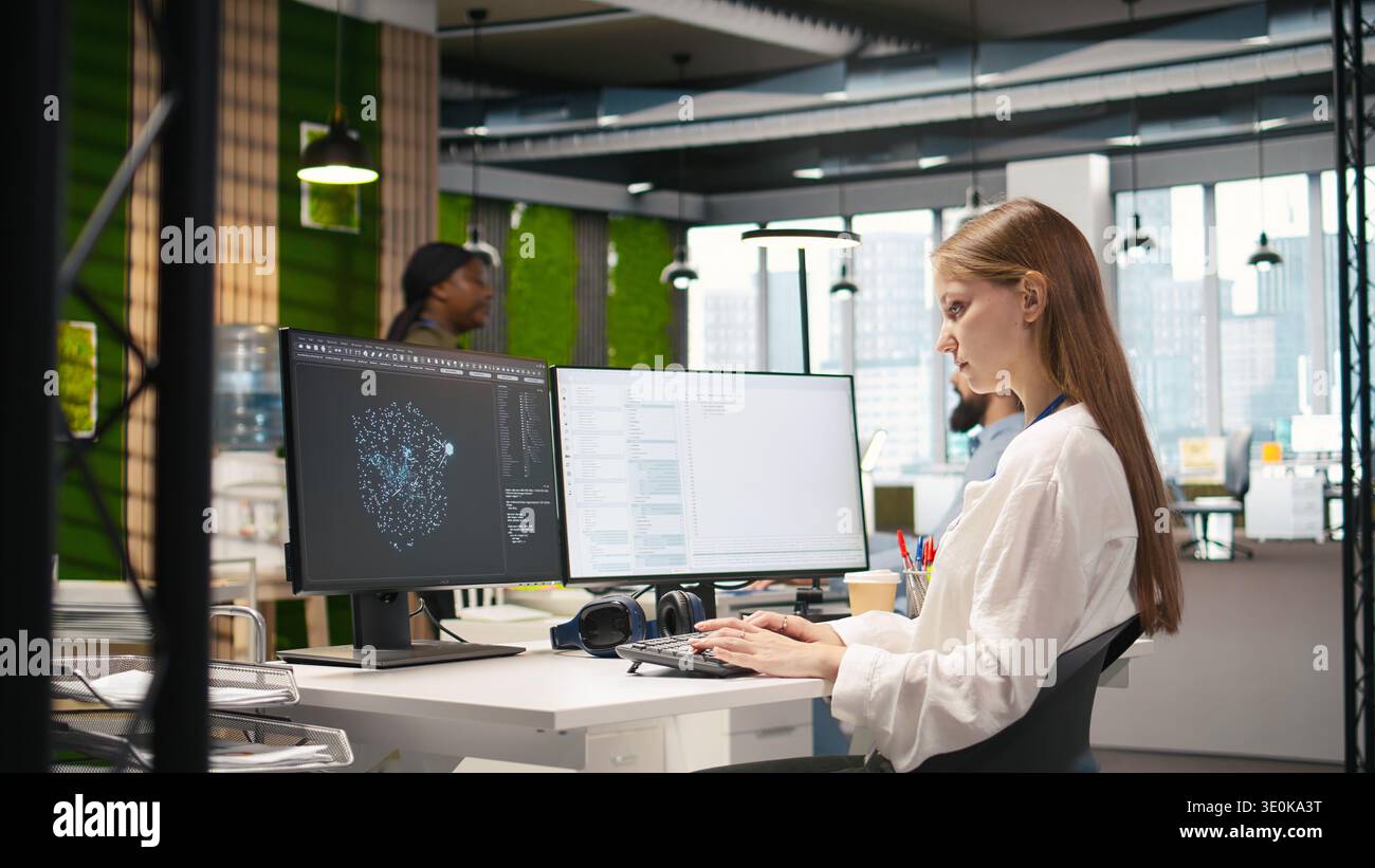 Junior developer optimizing performance using AI LLM chatbot recommendations. Young woman uses artificial intelligence assistant to convert manual workflows into automated scripts, camera A Stock Photo