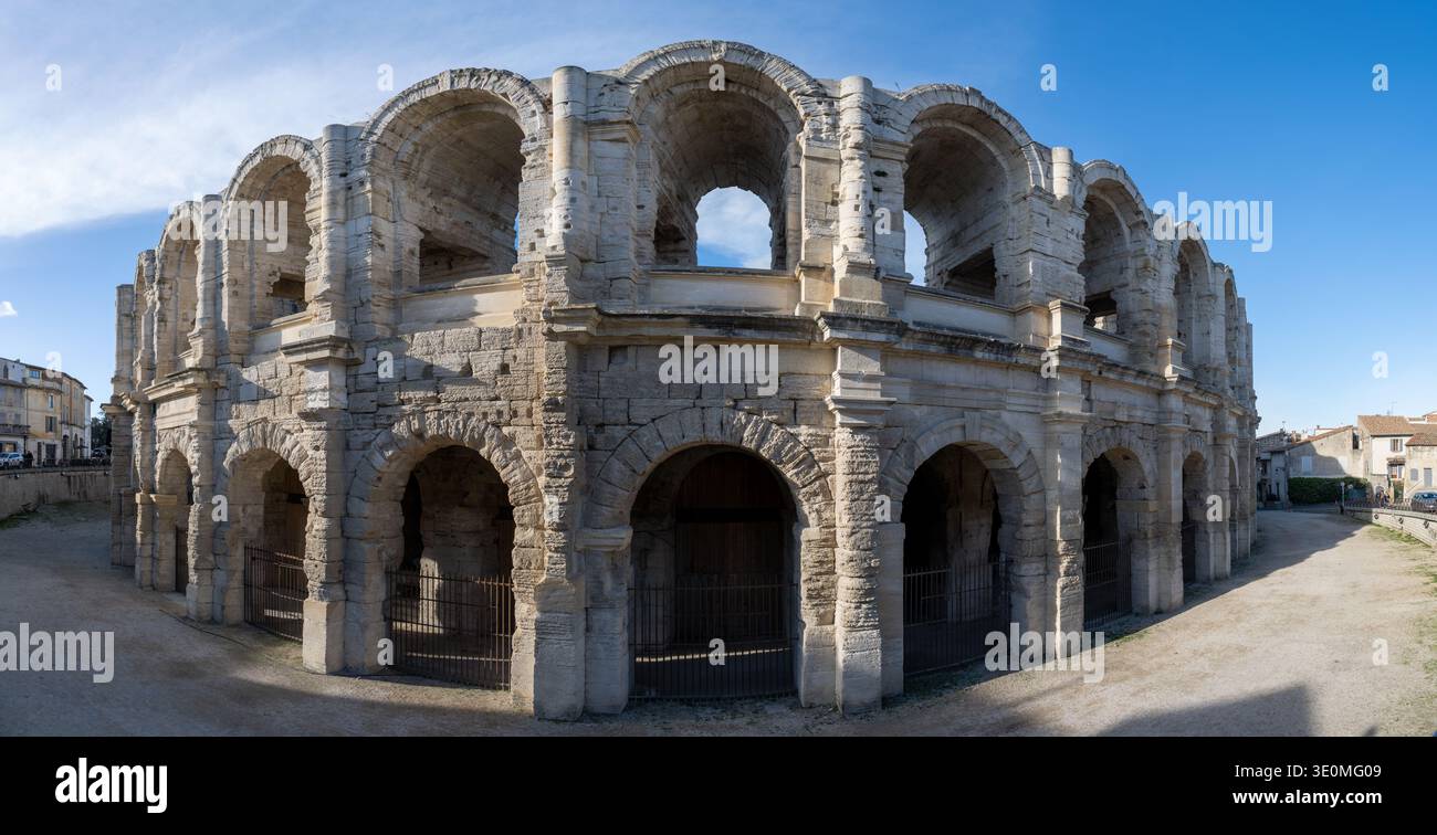 Wide panoramic view of the stone facade and arches of the Roman ...