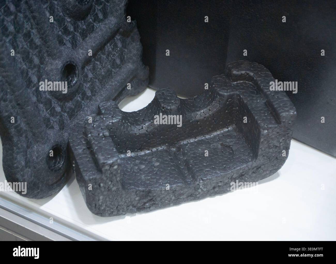 Products made from foamed polymers expanded polypropylene EPP and expanded polystyrene EPS. Model of dense and lightweight material, universal foam. New modern technologies. Industrial manufacturing Stock Photo